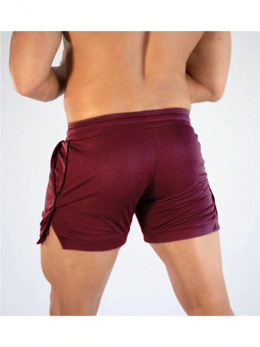 Manfinity Sport Streetwear Boyfriend Style Men Letter Graphic Drawstring Waist Split Hem Sports Stretchy Shorts Gym Shorts